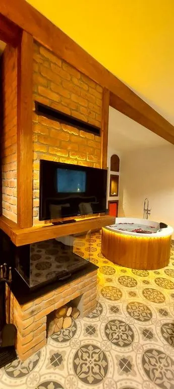 Jakuzili ve Şömineli Deluxe Oda,Deniz Manzaralı,Şömineli ve Jakuzili