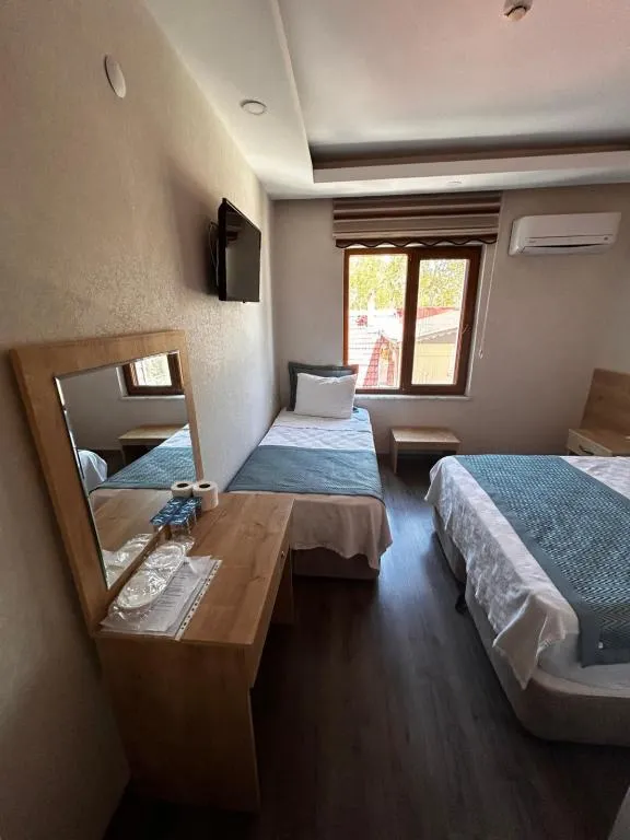 Üç Kişilik Oda