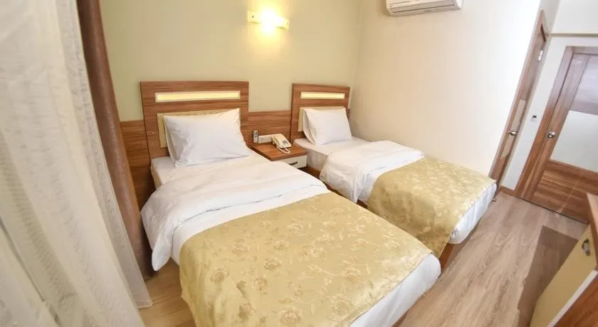 2 tek yataklı oda- iki kişilik