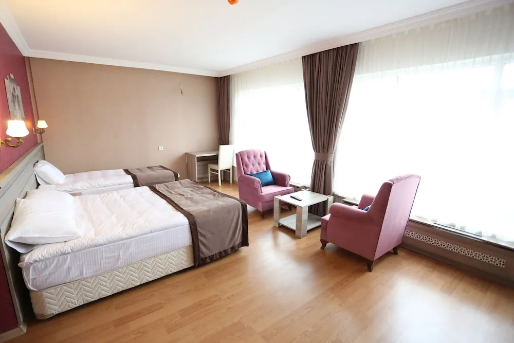 Deluxe Tek Büyük veya İki Ayrı Yataklı Oda
