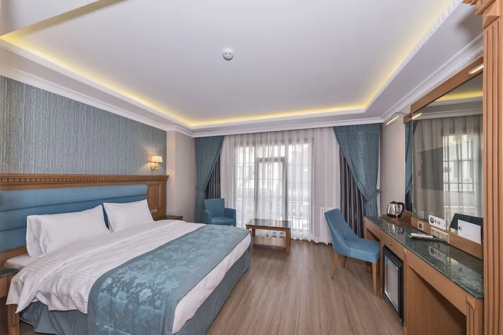 Deluxe Tek Büyük veya İki Ayrı Yataklı Oda