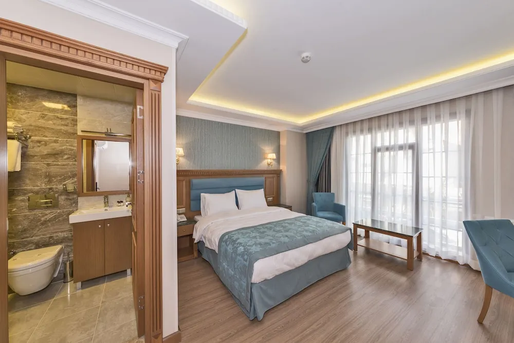 Deluxe Tek Büyük veya İki Ayrı Yataklı Oda