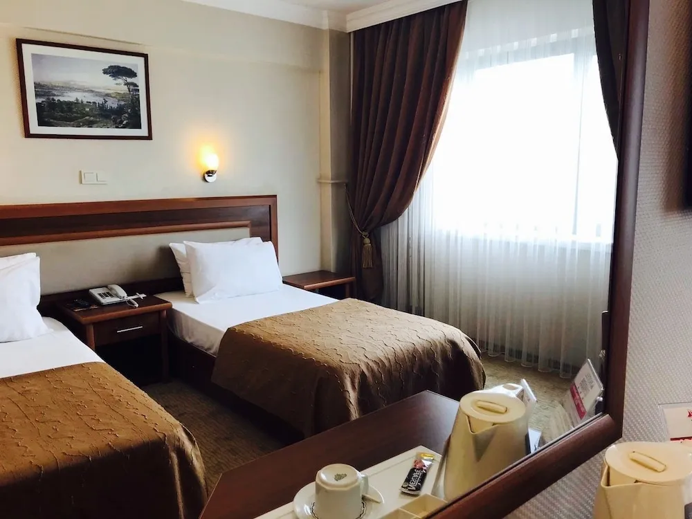 Deluxe Tek Büyük veya İki Ayrı Yataklı Oda
