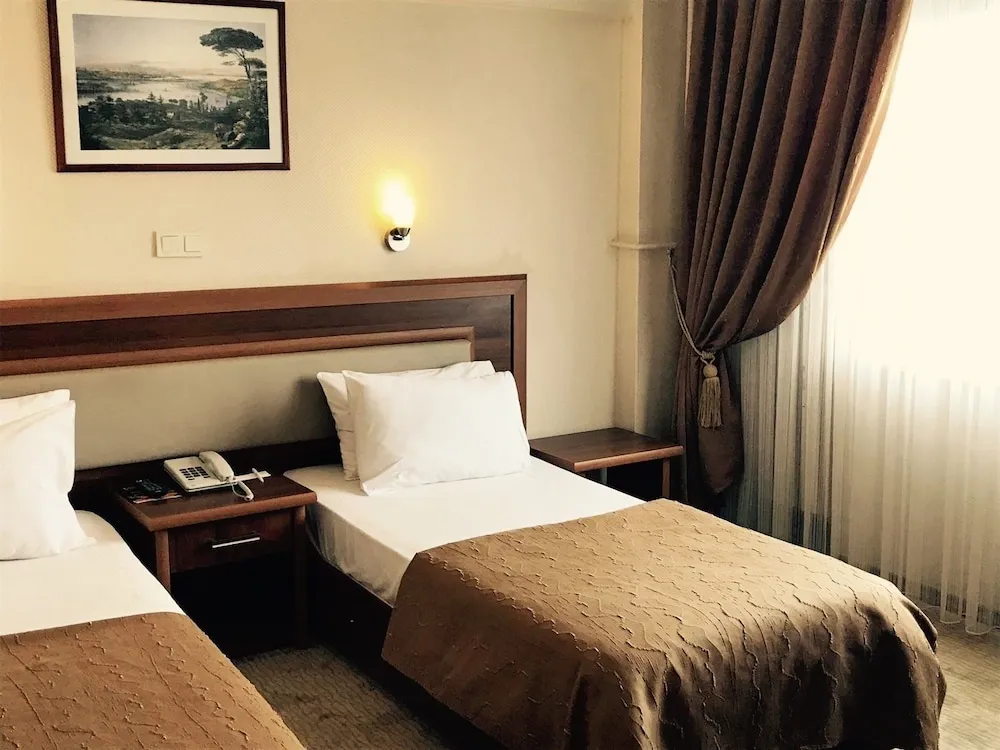 Deluxe Tek Büyük veya İki Ayrı Yataklı Oda